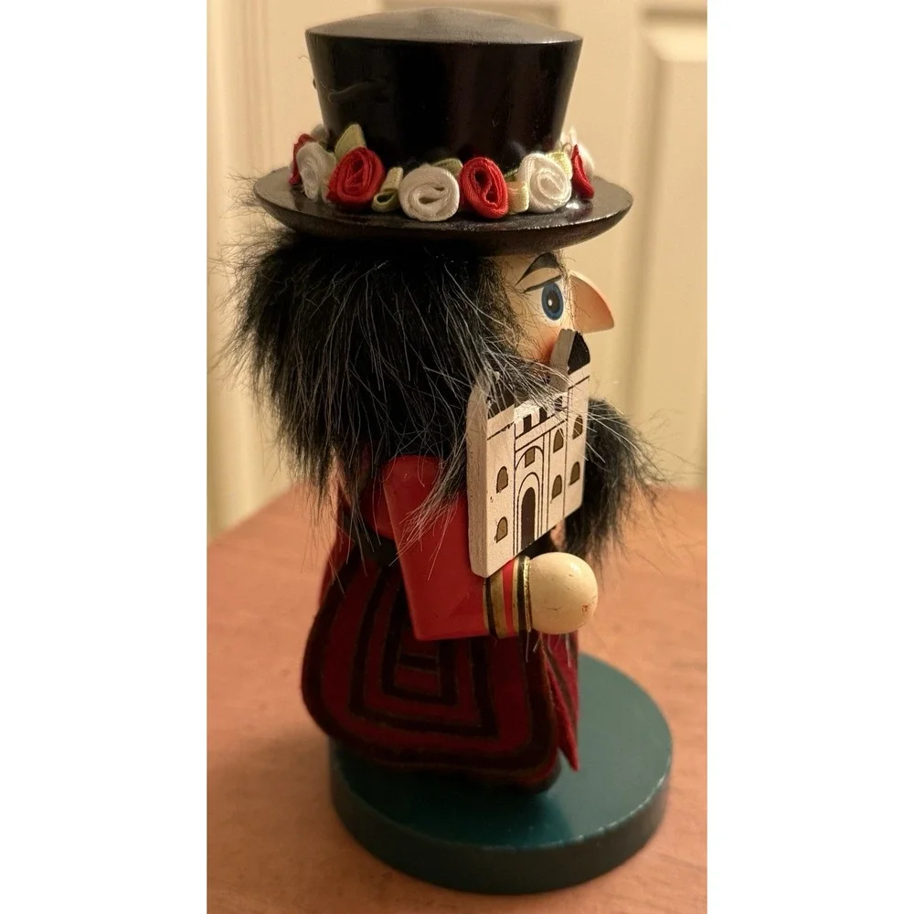 RED STUBBY MULTICOLOR WOODEN NUTCRACKER W/FLOWERED HAT - ENGLISH‎